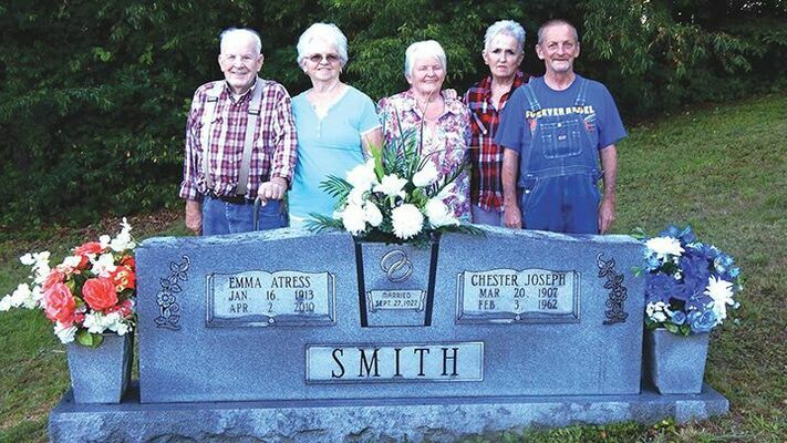 Siblings standing behind their parents headstone at Counts Chapel.  Pictured from left to right are Bill, Charlotte, Cookie, Genoa and Joe. (Three other siblings are deceased, Eda Gay Patton, a former teacher and school board member in Dickenson County, Patsy Blankenship, also a lifelong resident of Dickenson County, and Cheryl Clay, who lived in many places while her husband was in the army but then after he retired they returned to Dickenson County to live on Bise Ridge). 