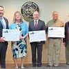 Splash pad project promoters gathered Friday to commemorate the funding package. Left to right are supervisors Vice Chair Josh Evans and Chair Peggy Kiser, County Administrator Larry Barton, Clintwood Mayor Danny Lambert and VCEDA chief executive Jonathan Belcher.  VCEDA PHOTO